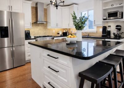 cabinet painting done in white with black hardware