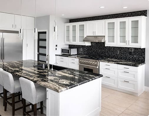 White kitchen cabinets with black granite countertop after cabinet refinishing