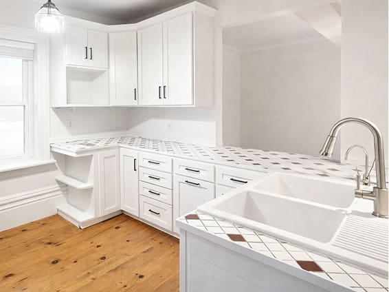 White laundry room cabinets after cabinet refinishing