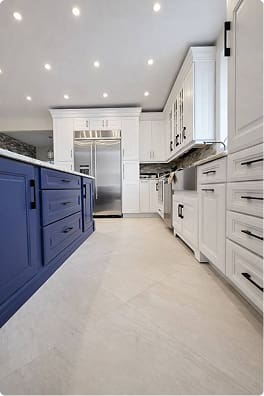 Navy blue kitchen island cabinets after cabinet refacing